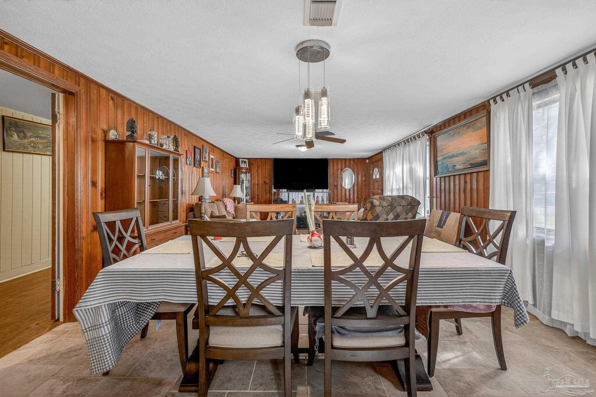 1450 East Burgess Road Pensacola, FL 32504 - Photo 34 of 49 a view of a dining room with furniture and window