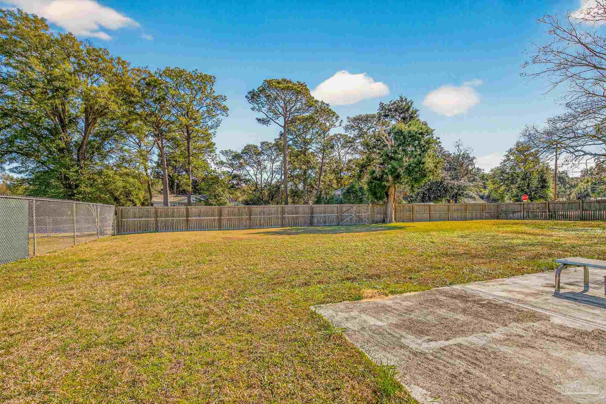 1450 East Burgess Road Pensacola, FL 32504 - Photo 41 of 49 a view of a swimming pool and an outdoor space