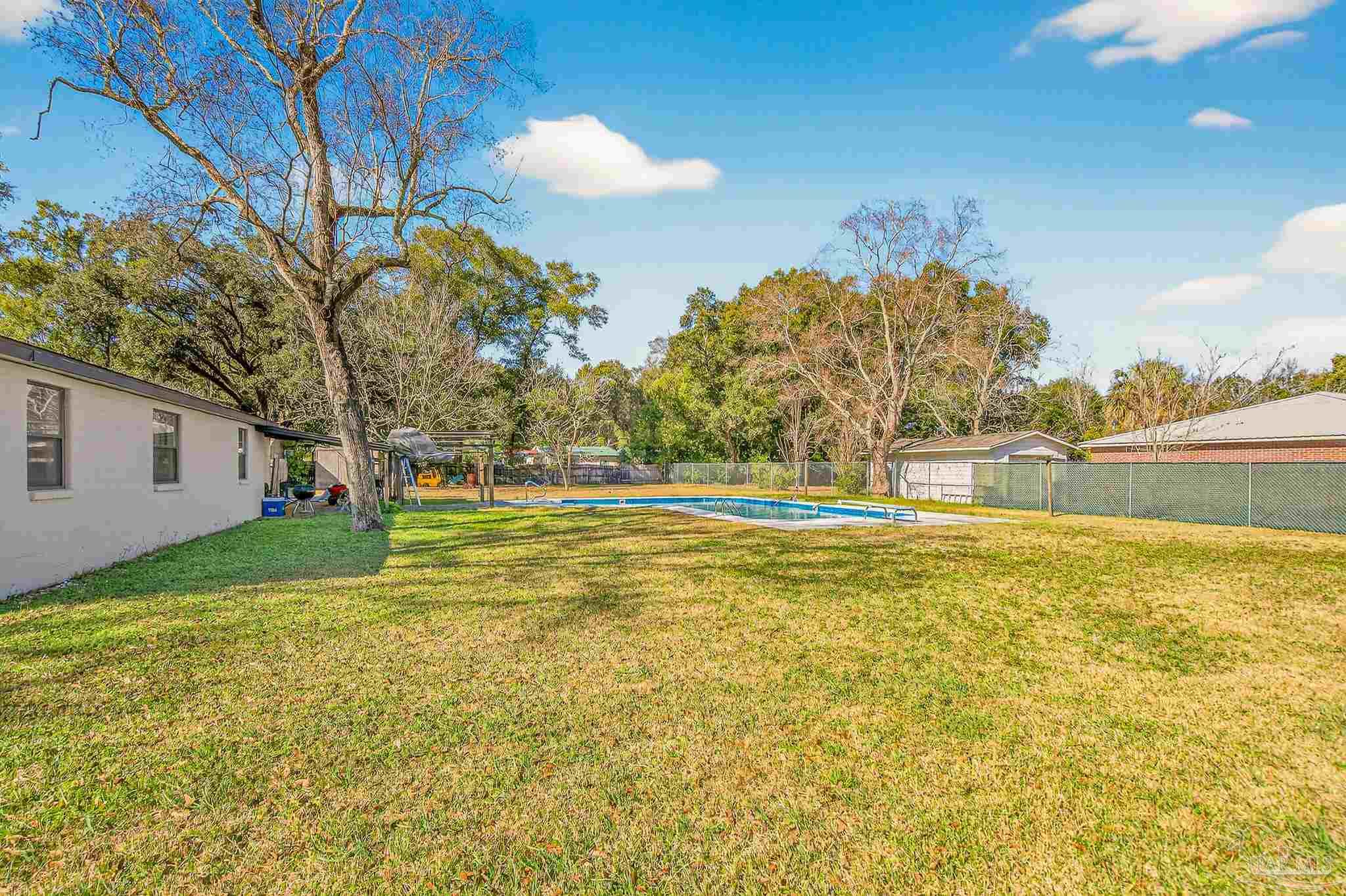 1450 East Burgess Road Pensacola, FL 32504 - Photo 44 of 49 a view of yard and swimming pool