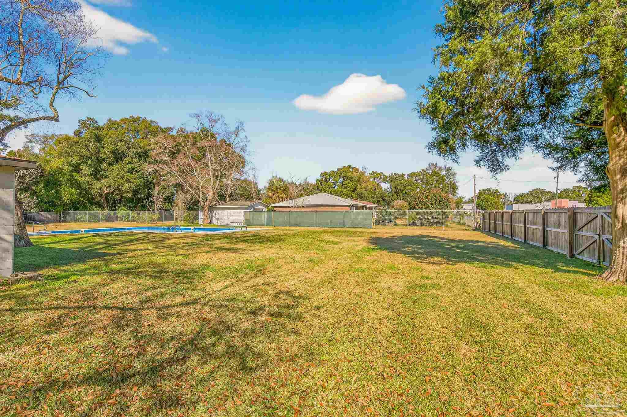 1450 East Burgess Road Pensacola, FL 32504 - Photo 45 of 49 a view of an ocean with a house