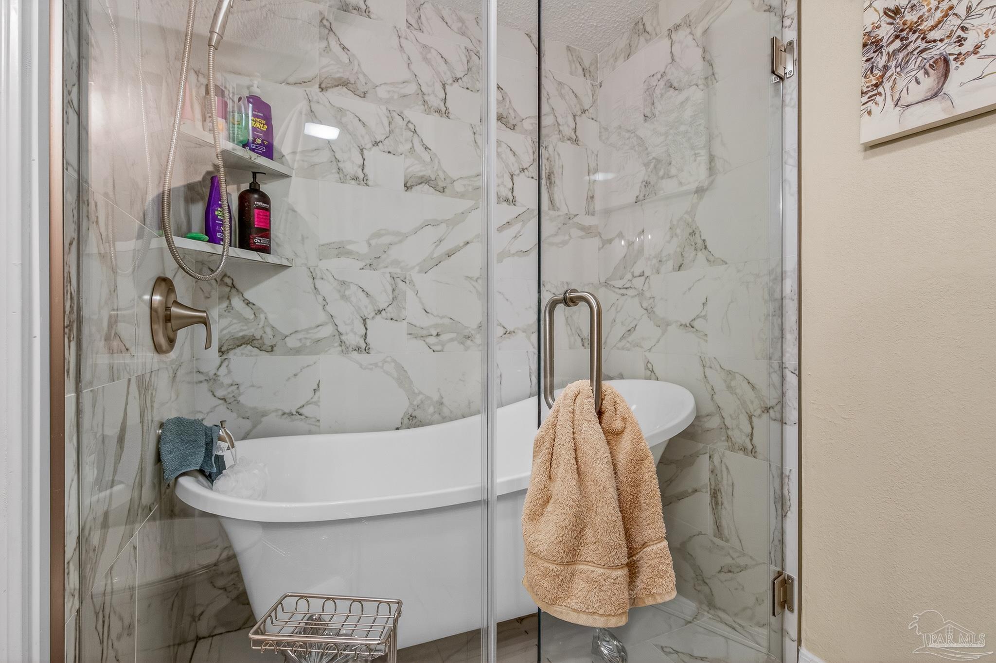 1450 East Burgess Road Pensacola, FL 32504 - Photo 6 of 49 a bathroom with a toilet and shower