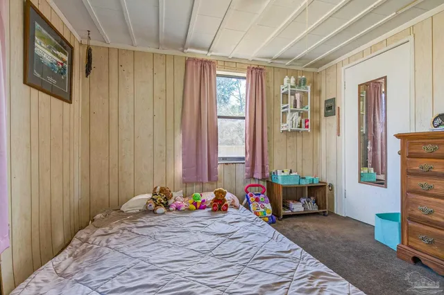 a bed room with a bed and a window