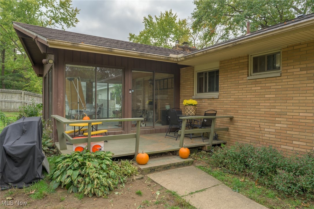 1177 Munroe Falls Kent Road Kent, OH 44240 - Photo 22 of 47 Property rear entrance with a wooden deck and four-seasons room