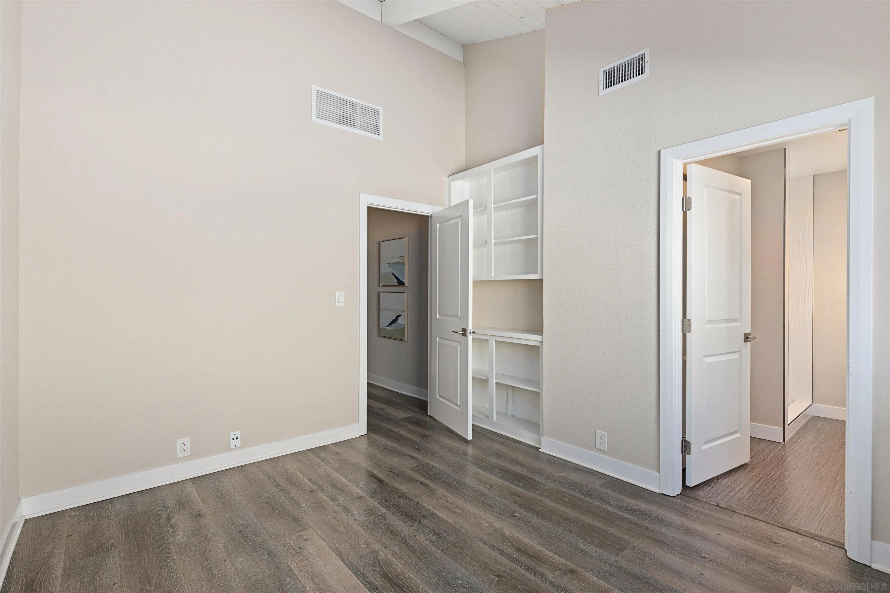 1913 Alga Road, Unit A Carlsbad, CA 92009 - Photo 19 of 44 a view of empty room with wooden floor