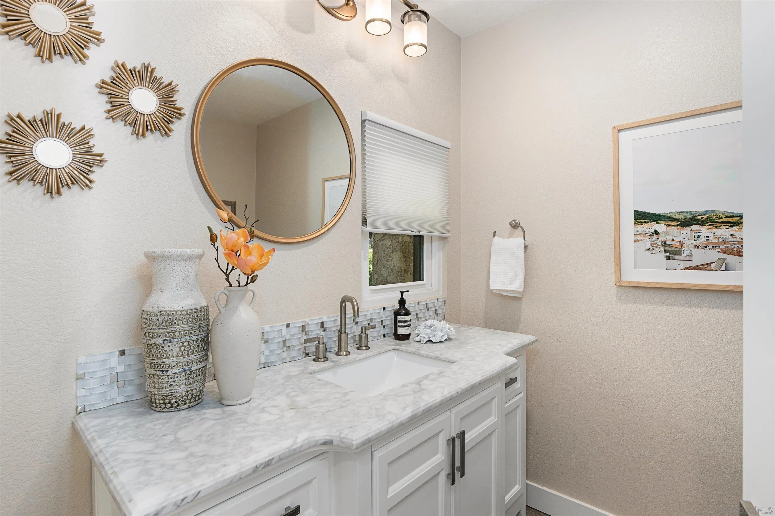 1913 Alga Road, Unit A Carlsbad, CA 92009 - Photo 9 of 44 a bathroom with a granite countertop sink and a mirror