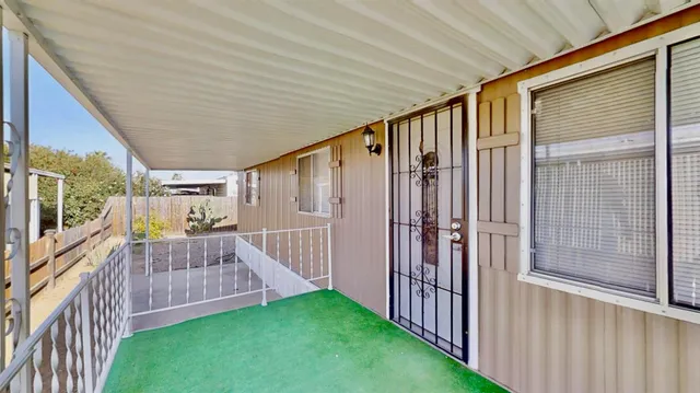 a bedroom with furniture and a wooden floor