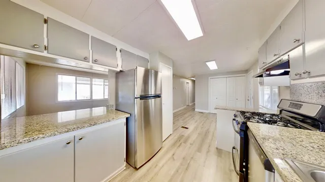 a bathroom with a bathtub a sink and mirrors