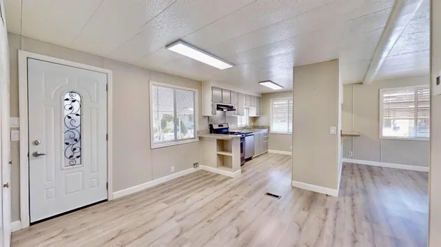 a view of an empty room and window