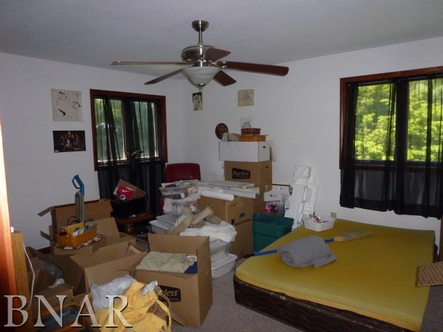 9637 Tabor Road Clinton, IL 61727 - Photo 14 of 17 a living room with furniture fireplace and flat screen tv