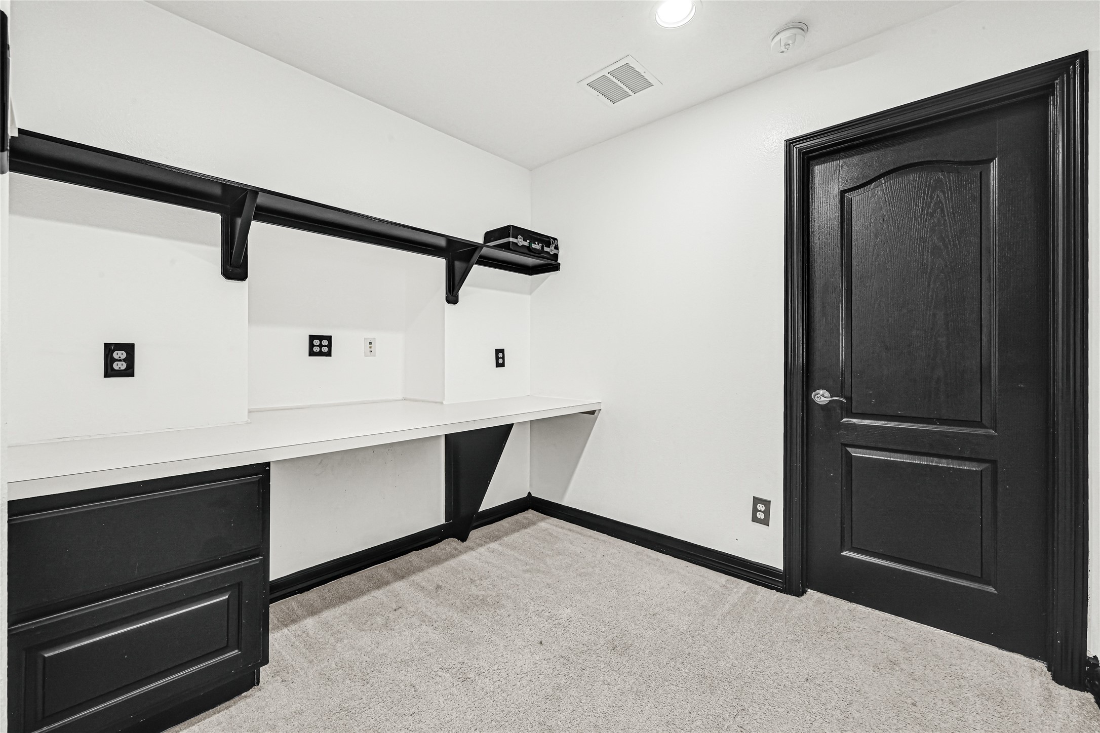 14714 Placid Point Humble, TX 77396 - Photo 30 of 37 This room features a built-in desk with ample shelving with sleek and functional workplace.