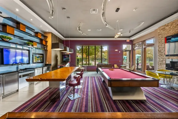 a room with furniture and pool view