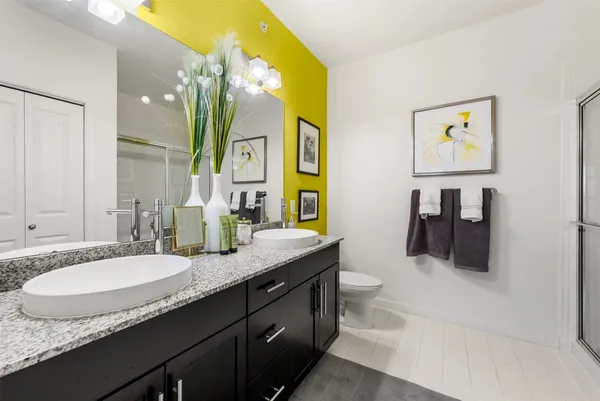 a living room with patio furniture and a floor to ceiling window