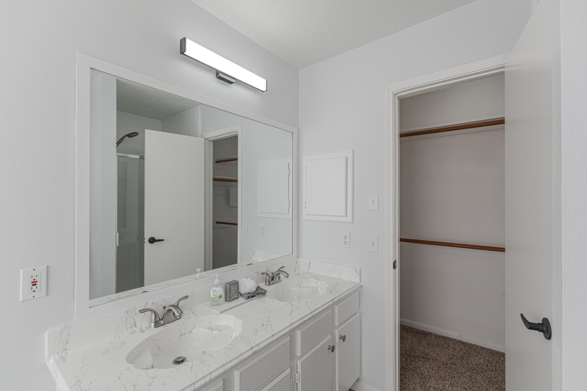 10347 Mist Lane Houston, TX 77070 - Photo 18 of 32 a bathroom with a sink and a mirror