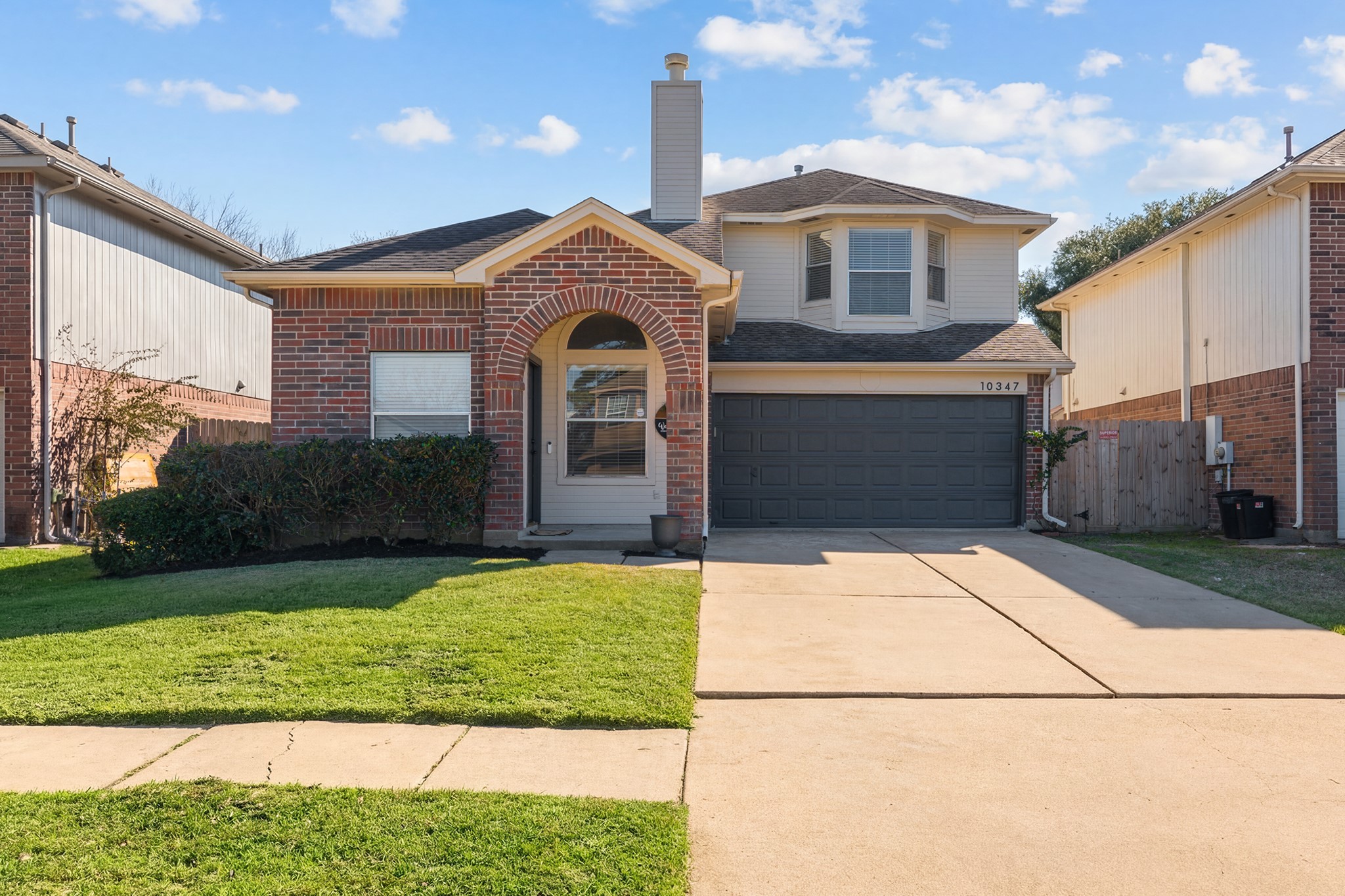 10347 Mist Lane Houston, TX 77070 - Photo 2 of 32 a front view of a house with garden