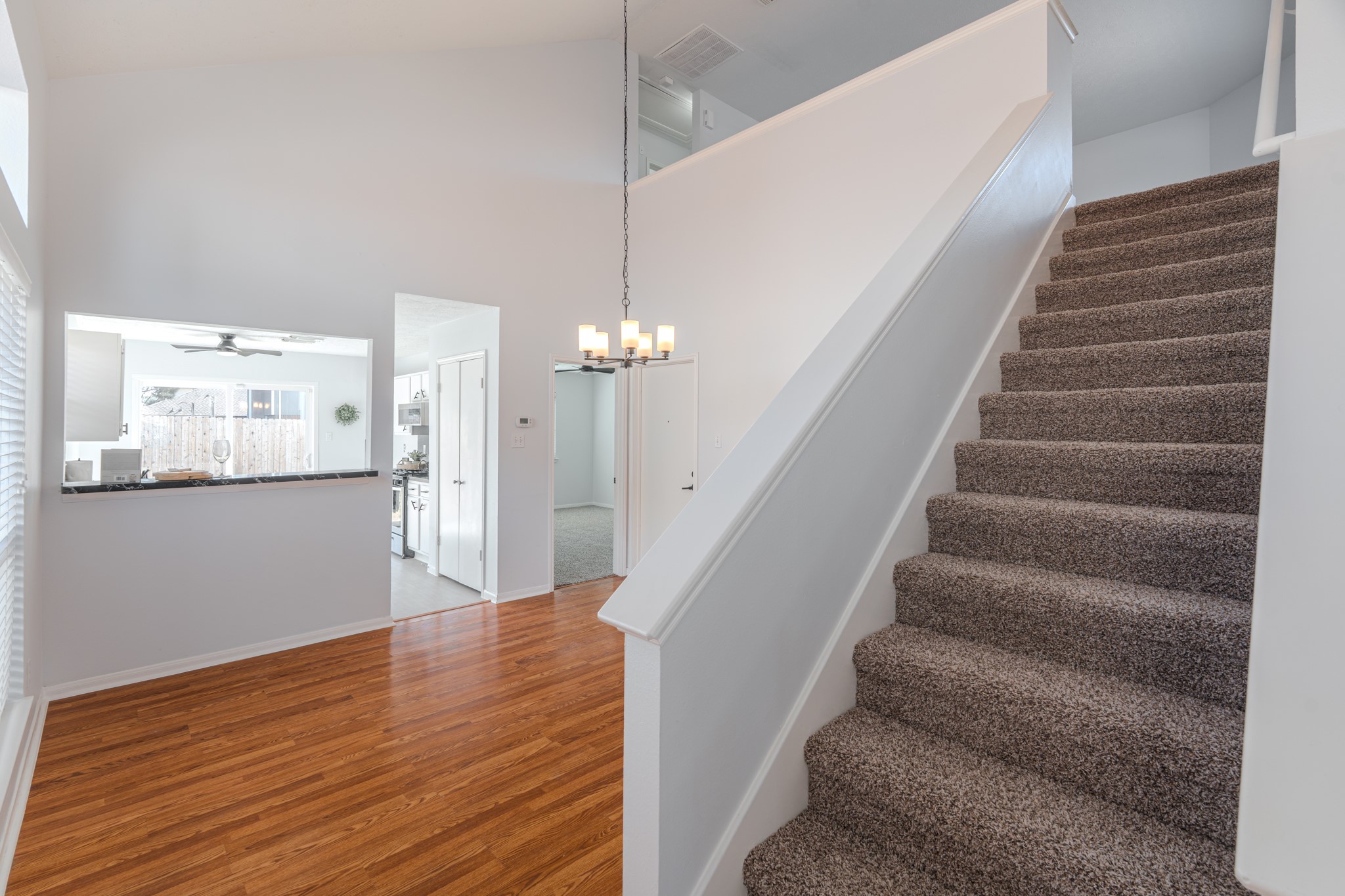 10347 Mist Lane Houston, TX 77070 - Photo 21 of 32 a view of entryway and hall with wooden floor