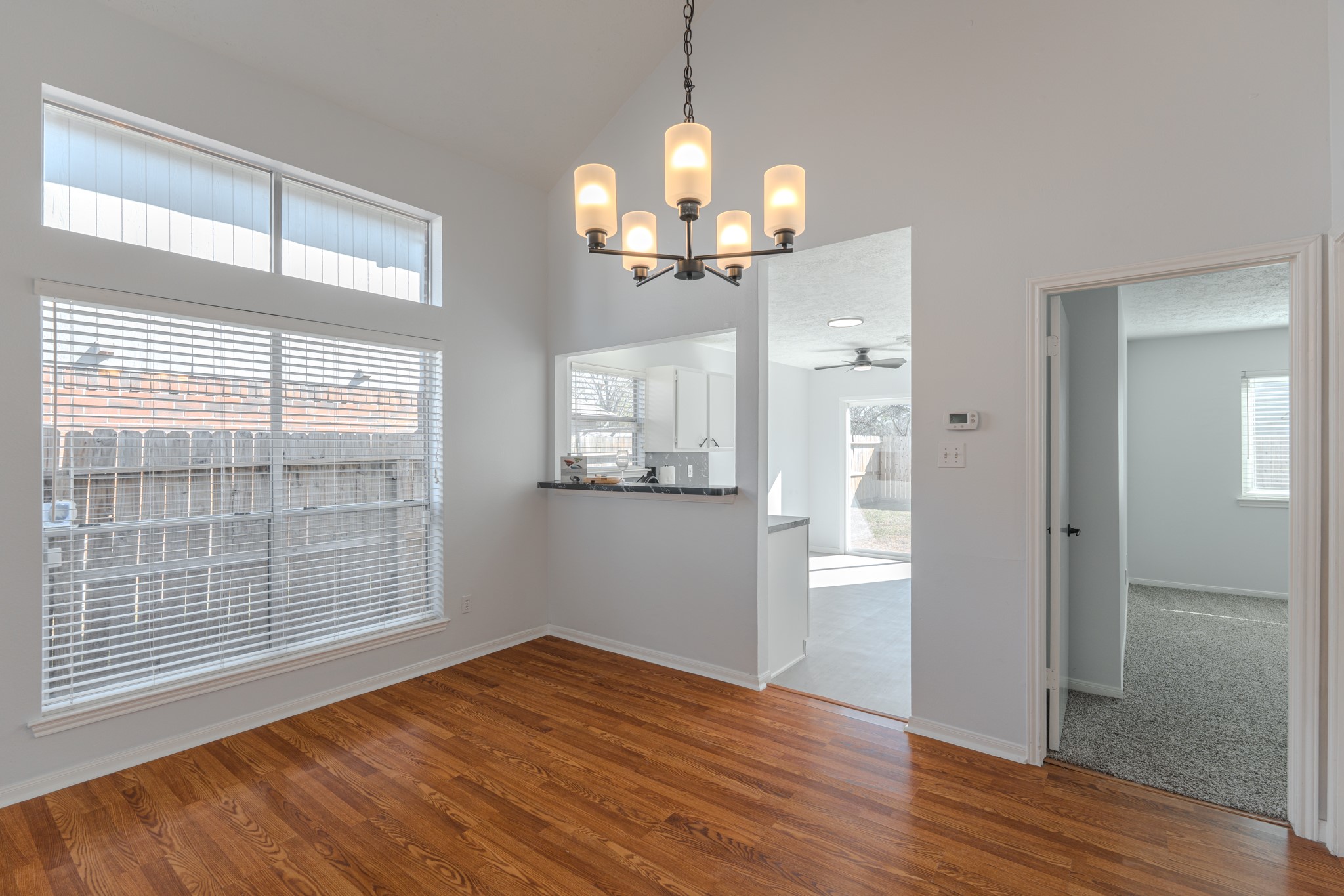 10347 Mist Lane Houston, TX 77070 - Photo 10 of 32 a view of an empty room with wooden floor and a window