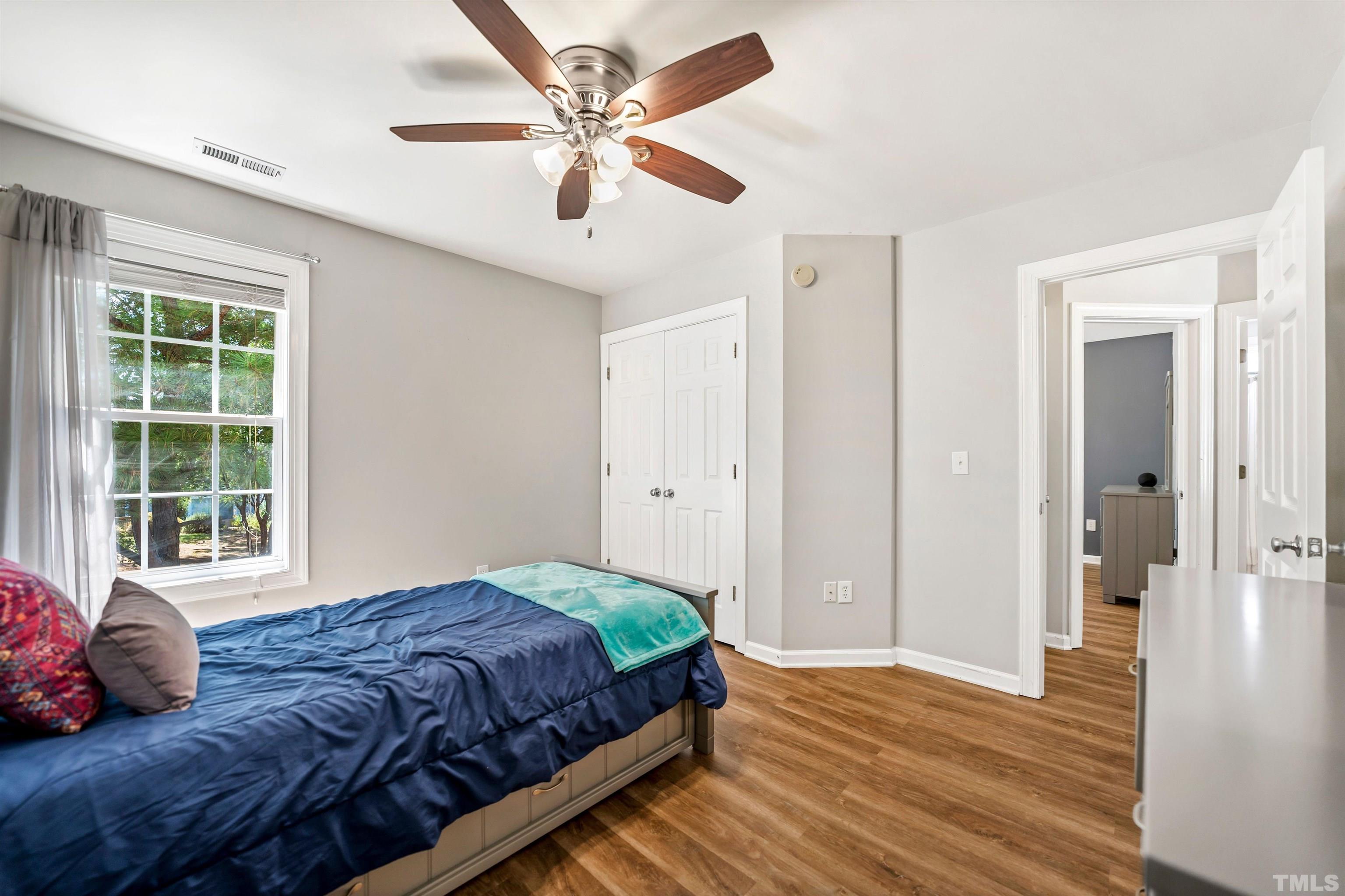 3012 White Cloud Circle Apex, NC 27502 - Photo 19 of 31 a bedroom with a large bed and a window