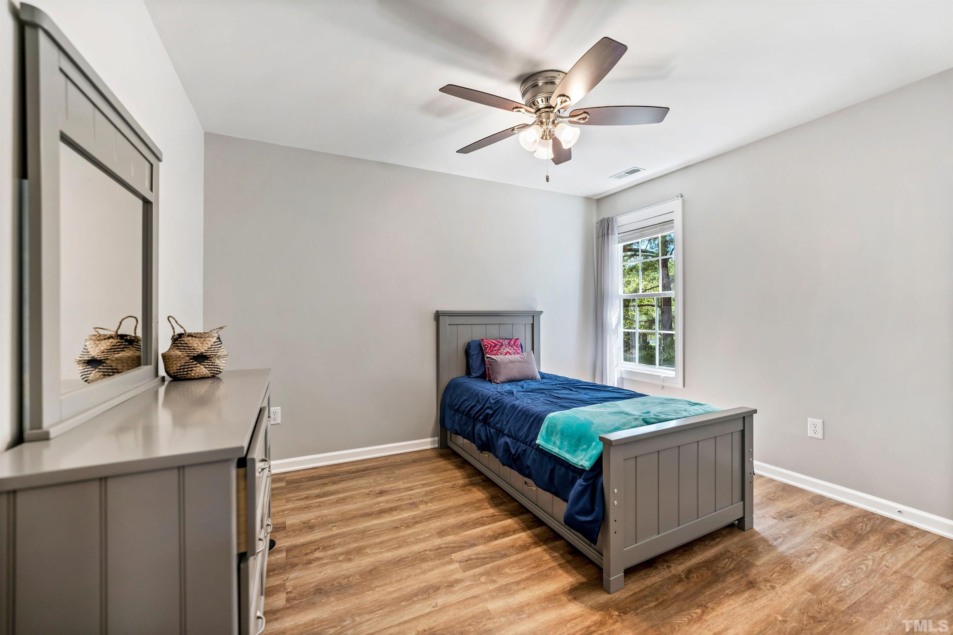 3012 White Cloud Circle Apex, NC 27502 - Photo 20 of 31 a living room with a bed furniture and a window