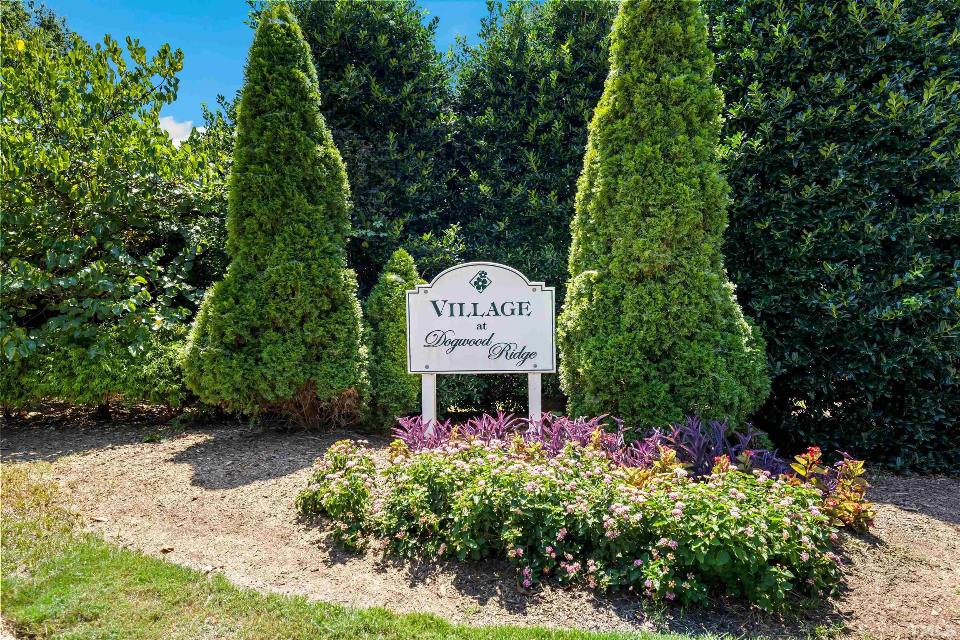 3012 White Cloud Circle Apex, NC 27502 - Photo 2 of 31 a view of a sign in a garden