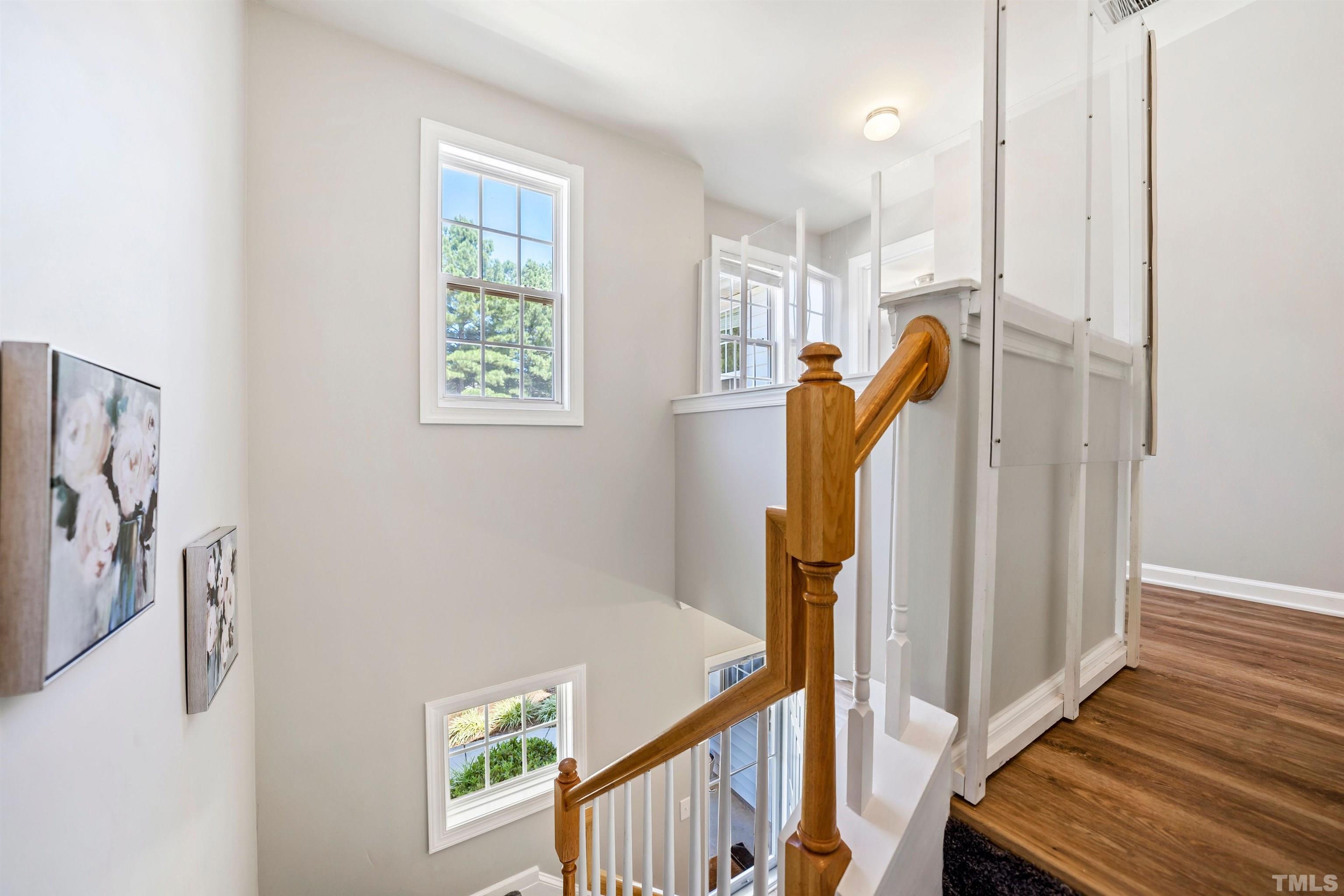 3012 White Cloud Circle Apex, NC 27502 - Photo 22 of 31 a view of a hallway with windows and stairs