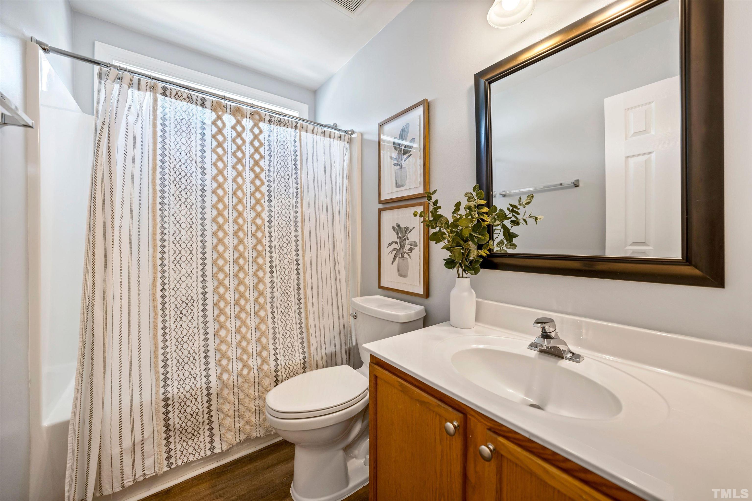 3012 White Cloud Circle Apex, NC 27502 - Photo 23 of 31 a bathroom with a sink a toilet and shower