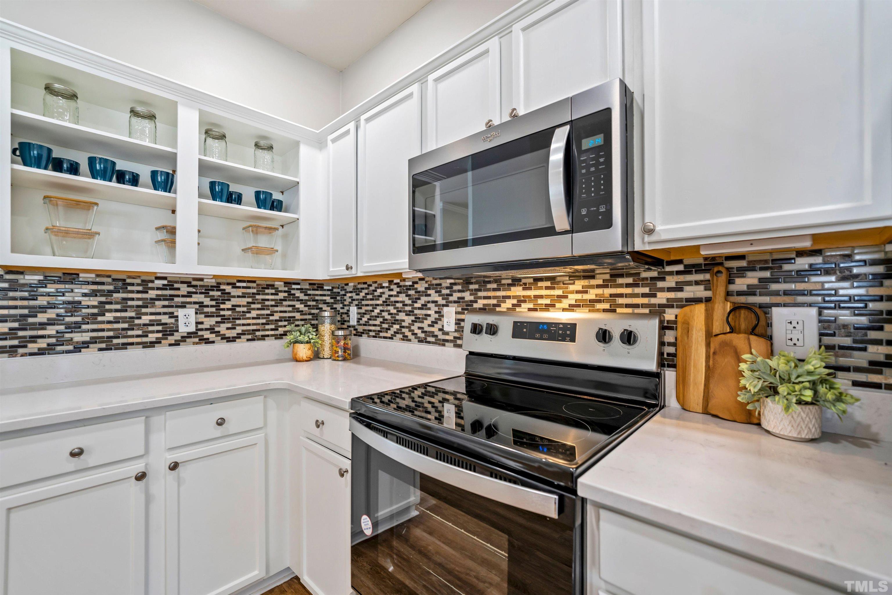 3012 White Cloud Circle Apex, NC 27502 - Photo 7 of 31 a kitchen with cabinets and appliances