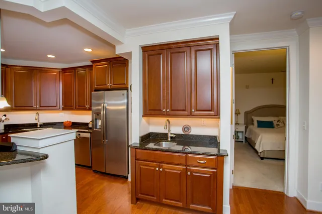 a living room with furniture a fireplace and a table