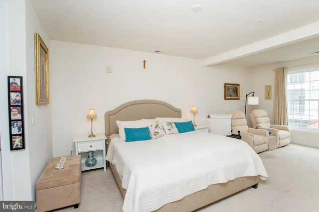 a bedroom with furniture and a window