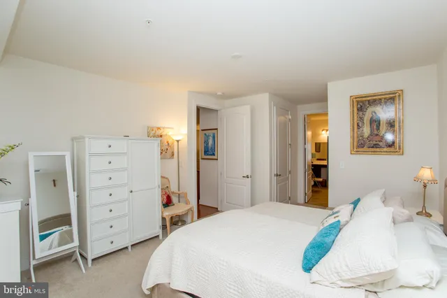 a spacious bathroom with a sink double vanity and a mirror