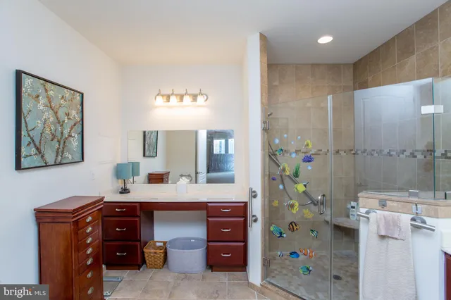 a view of a livingroom with workspace and a couch