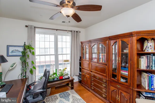 a bathroom with a sink vanity mirror and toilet