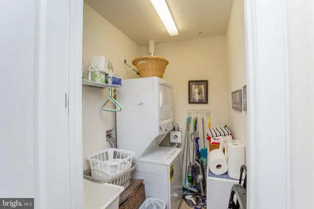 a view of a dining room with furniture and flowers