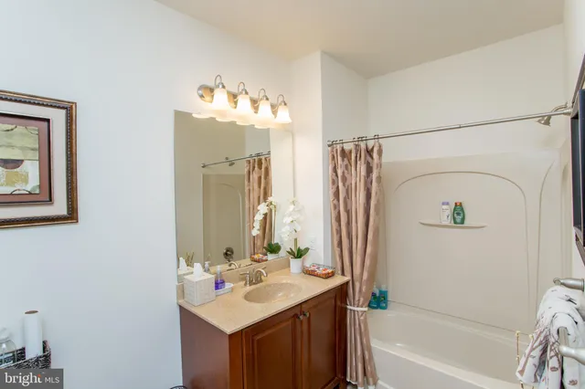 a view of a potted flower in the front of a house