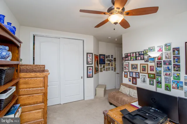 a room with pool table and windows