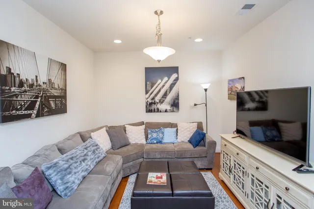 a kitchen with stainless steel appliances a refrigerator and wooden cabinets