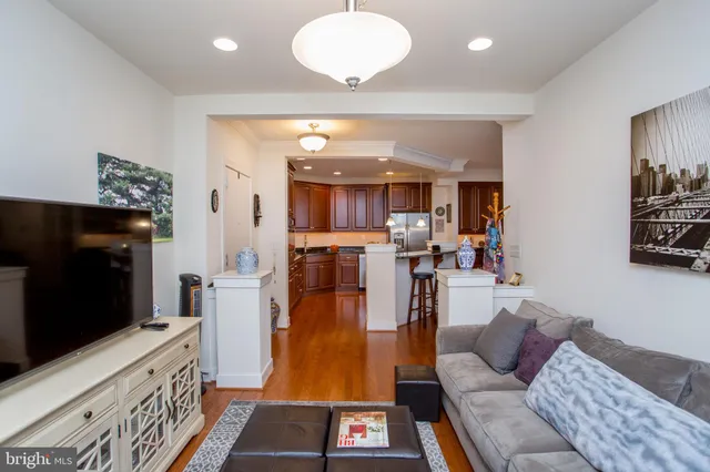 a kitchen with stainless steel appliances granite countertop a refrigerator stove and sink