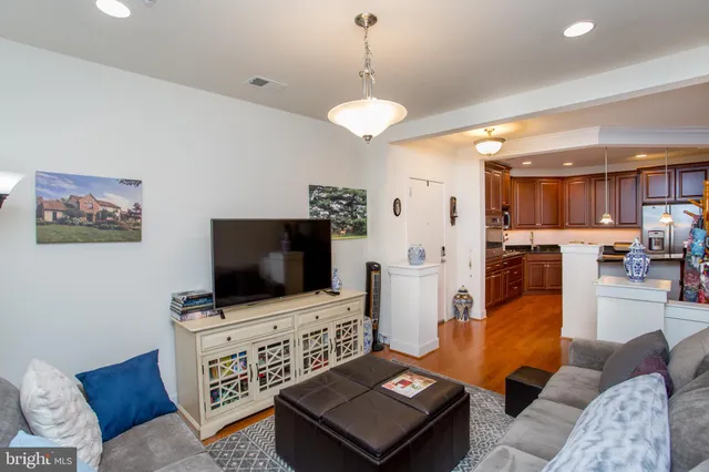 a kitchen with stainless steel appliances granite countertop wooden cabinets a sink and dishwasher