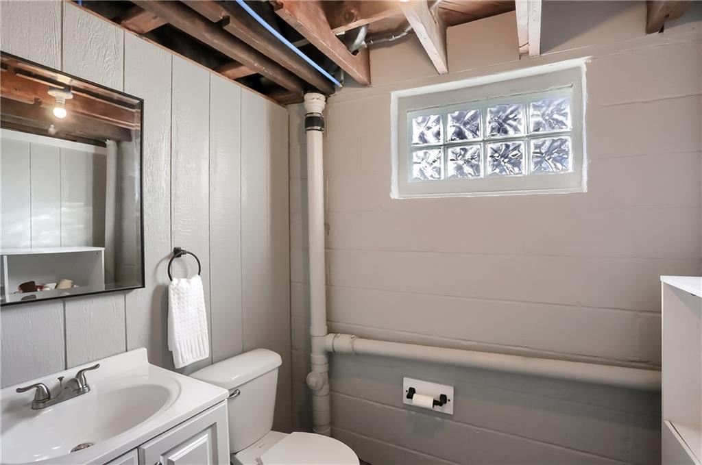 2431 Ridge Rd Extension Ambridge, PA 15003 - Photo 22 of 25 a bathroom with a toilet sink and mirror