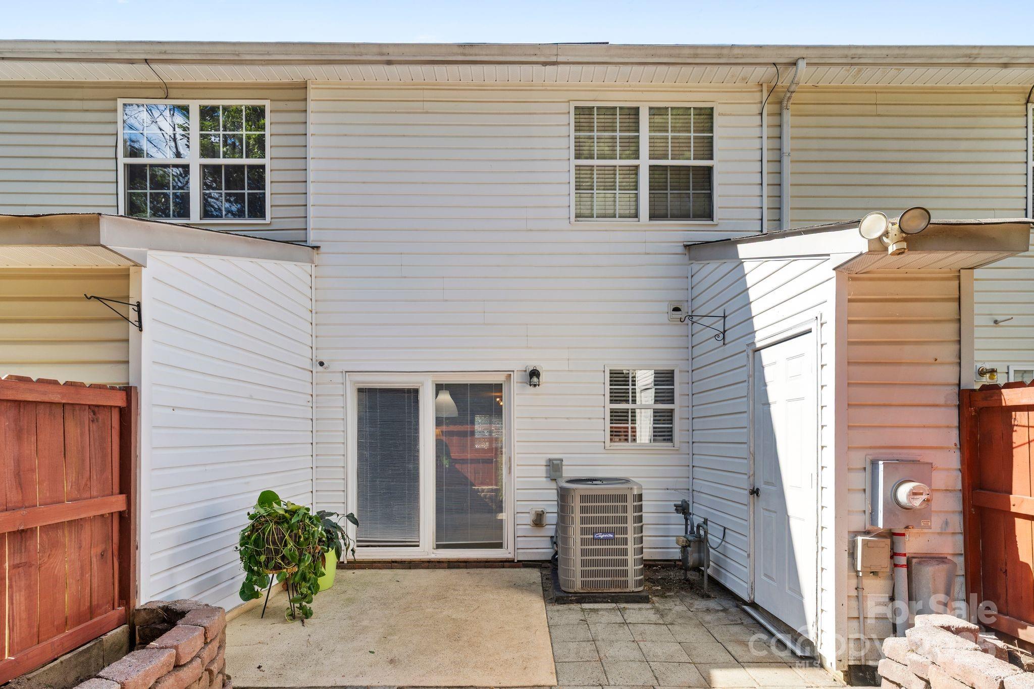 11643 Retriever Way Charlotte, NC 28269 - Photo 21 of 21 a view of a house with a window and brick walls