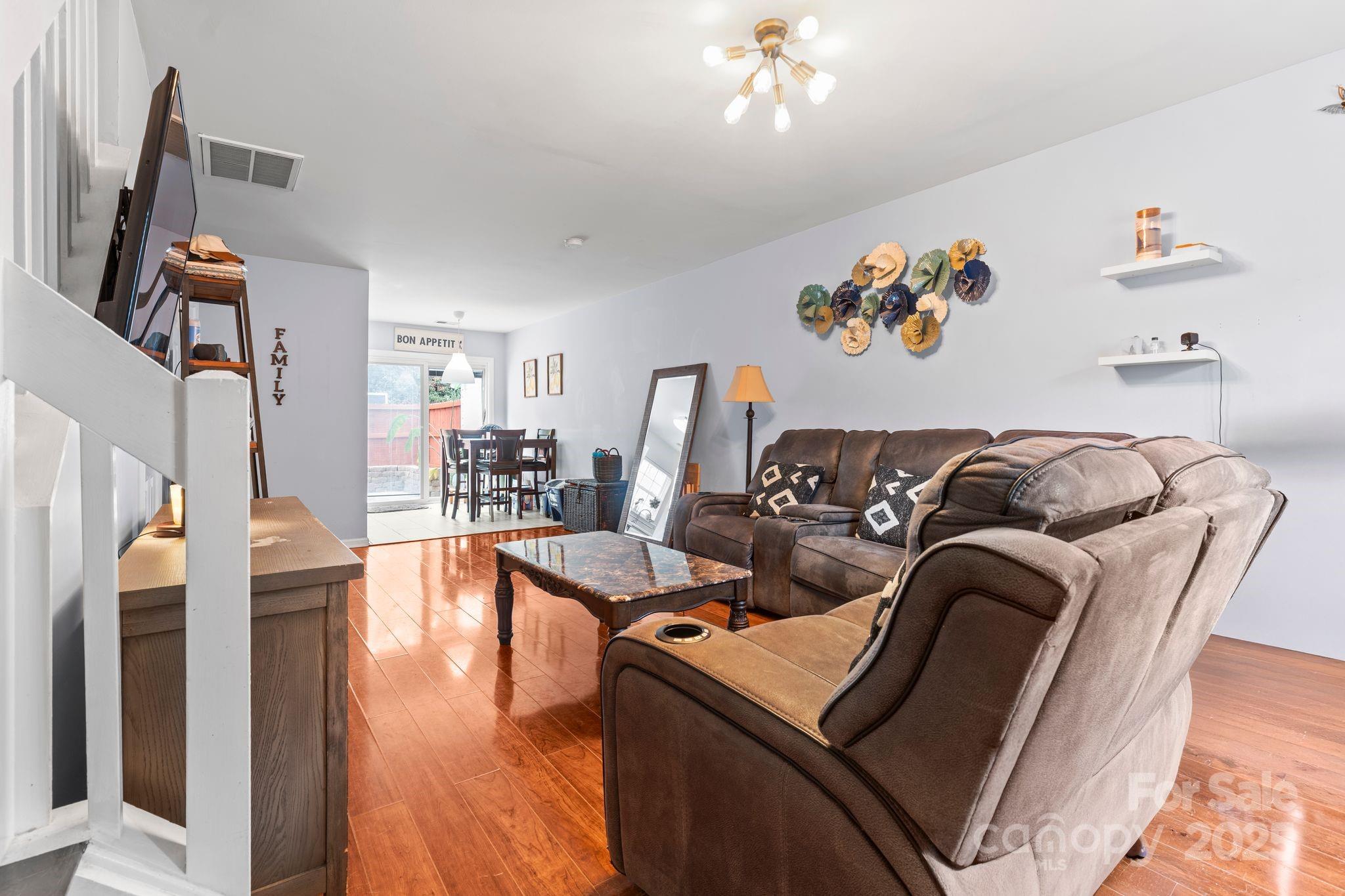 11643 Retriever Way Charlotte, NC 28269 - Photo 5 of 21 a living room with furniture and wooden floor