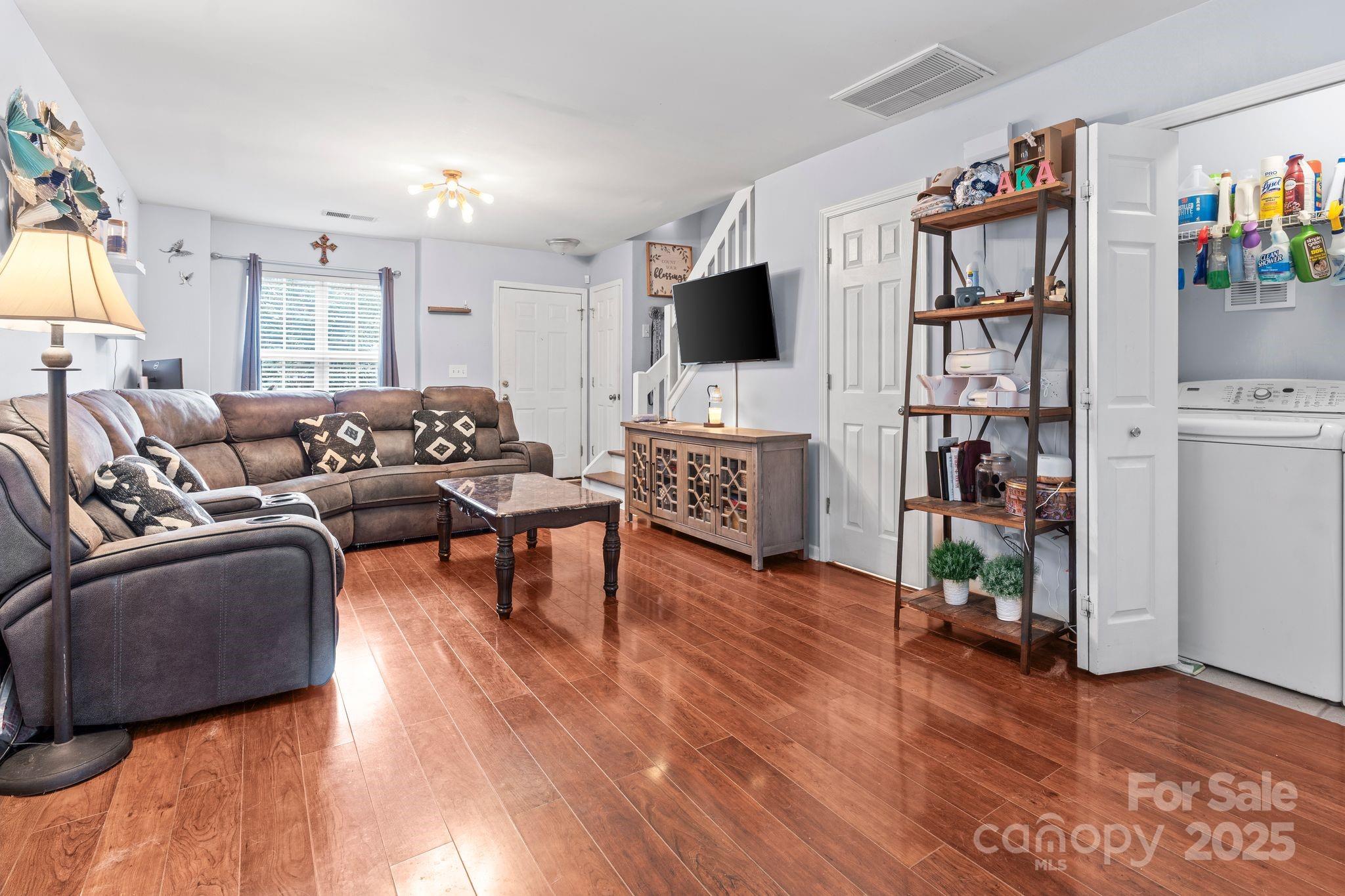 11643 Retriever Way Charlotte, NC 28269 - Photo 9 of 21 a living room with furniture and a flat screen tv