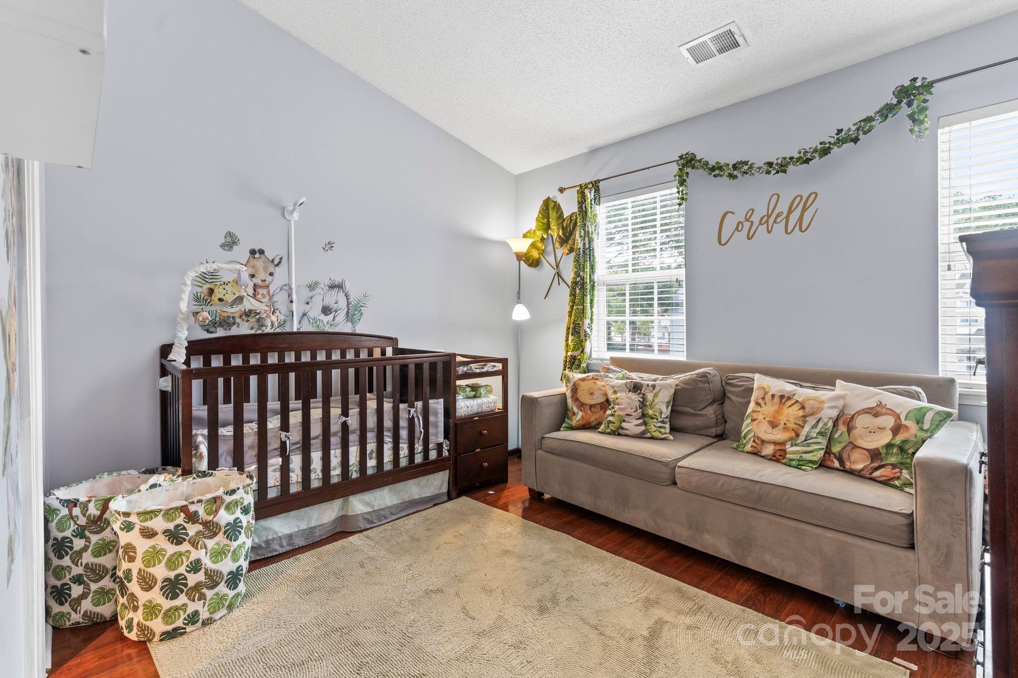 11643 Retriever Way Charlotte, NC 28269 - Photo 10 of 21 a bedroom with a bed and a couch