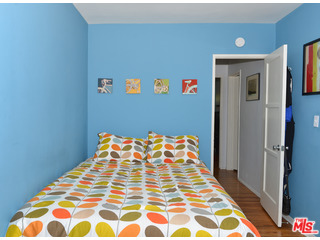 4066 Alla Road Los Angeles, CA 90066 - Photo 11 of 11 a bedroom with a bed and wooden floor