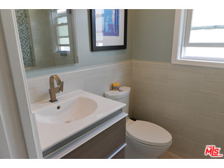 4066 Alla Road Los Angeles, CA 90066 - Photo 7 of 11 a bathroom with a sink a toilet and mirror
