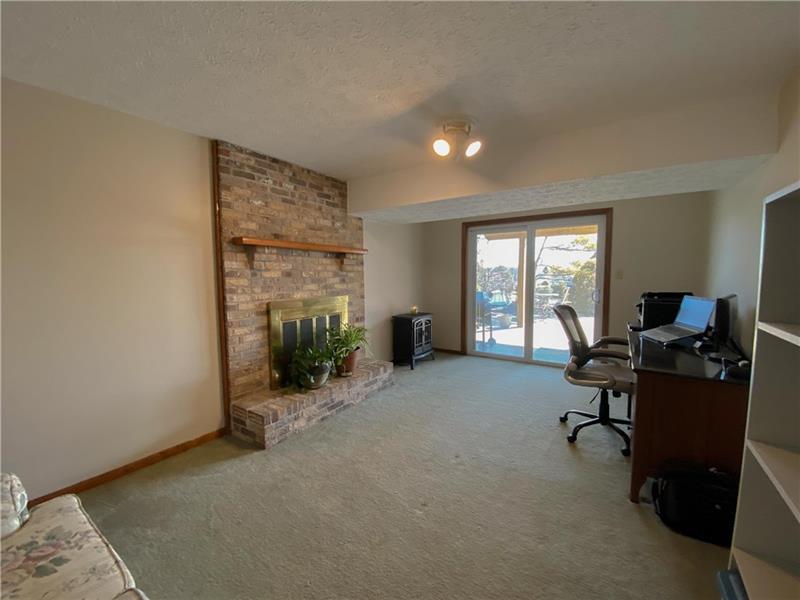 6 Hickory Grade Road Cecil, PA 15321 - Photo 17 of 25 Finished Lower level family room has its own wood burning fireplace and new sliding door out to the porch and yard area.