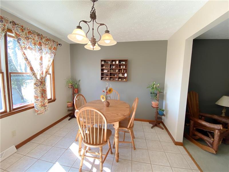 6 Hickory Grade Road Cecil, PA 15321 - Photo 9 of 25 Sunshine opens up the eating area across the kitchen and into the Living room.