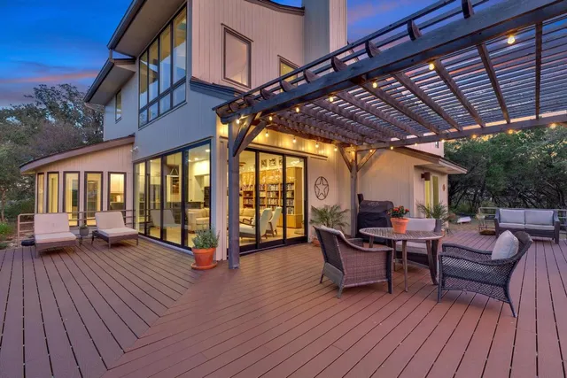 a view of a patio with a table and chairs