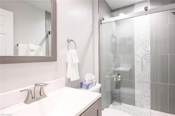 a bathroom with a sink and a mirror