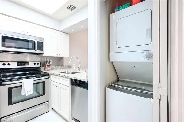 a kitchen with a stove and a microwave