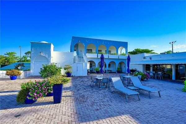 a view of hall with a fireplace